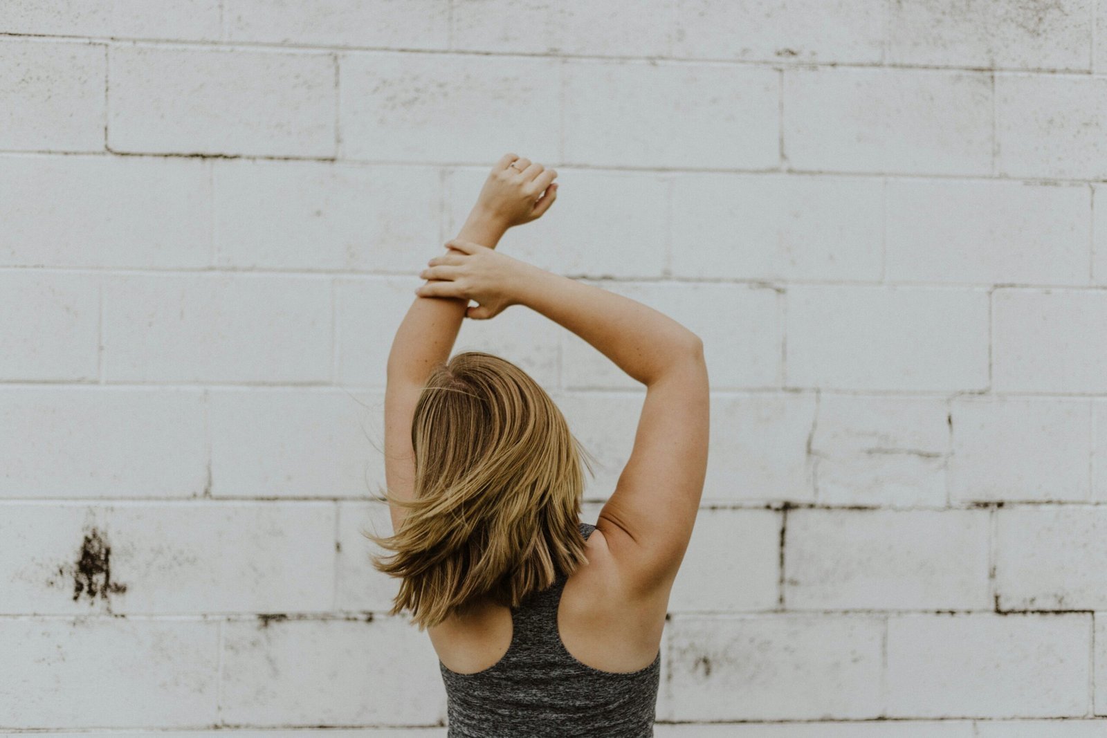 woman wearing grey racerback top